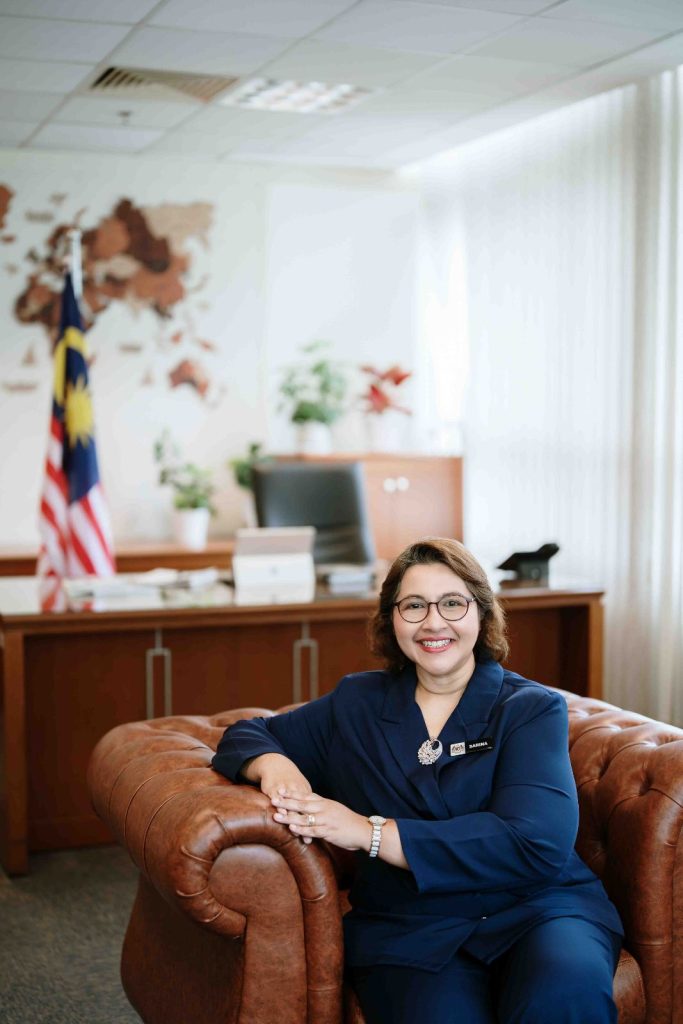 Relaxed portrait on a leather armchair in the office at Bahagian Pendidikan Swasta, Ministry of Education Putrajaya, corporate onsite photography by The Cade & Co